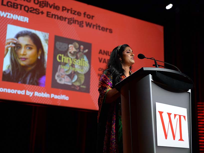 Anuja Varghese accepts an award